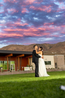 Couple dancing outside in the sunset against the Northern Nevada rolling hills