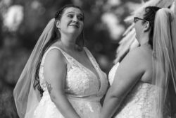 Fall wedding two brides smitten with each other during vows at Redhawk