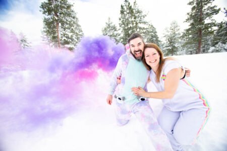 Smoke Bomb engagement Photos in the snow Lake Tahoe forest